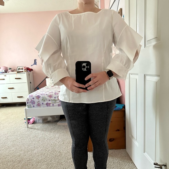 WHITE BLOUSE WITH DRAPED OPEN ARM SLEEVE WITH ELEGANT BUTTON CLOSURE - Picture 2 of 9